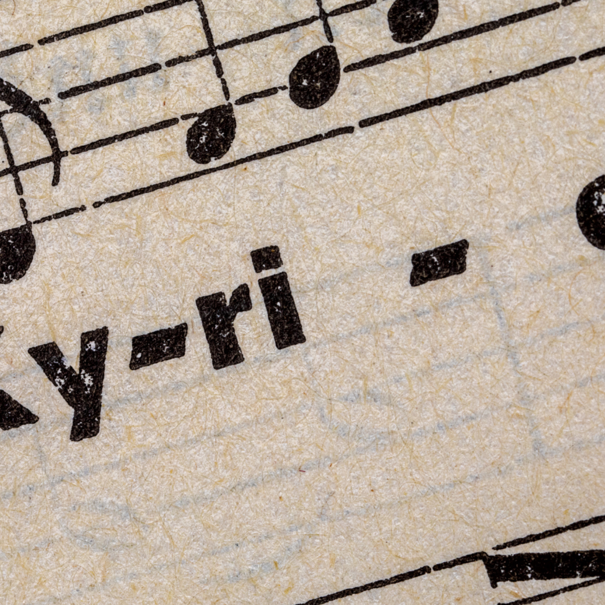 Sir, take it easy Ausschnitt aus einem Notenblatt mit einer Melodie und Text „Kyrie“.